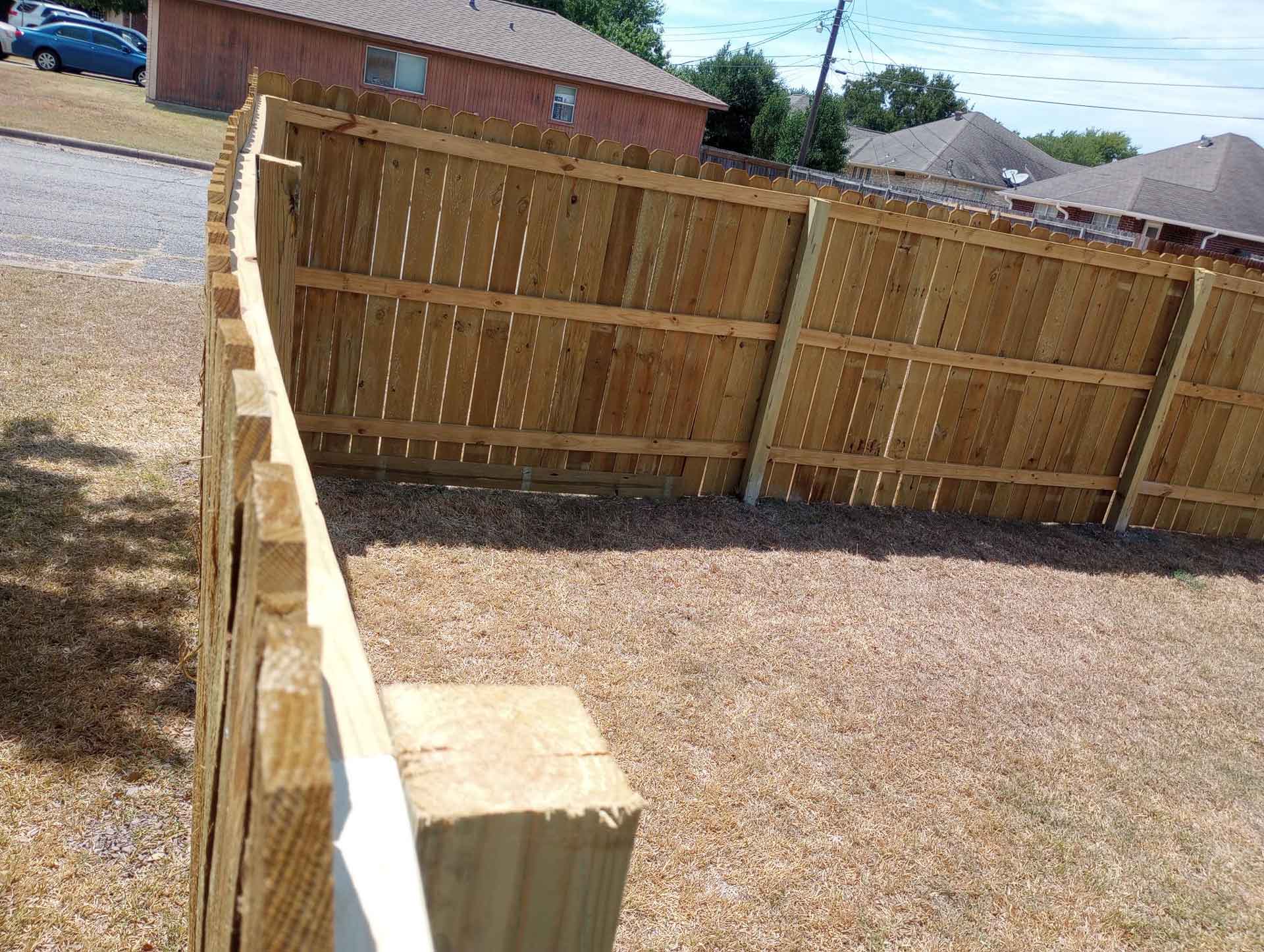 Corner of a wooden backyard fence
