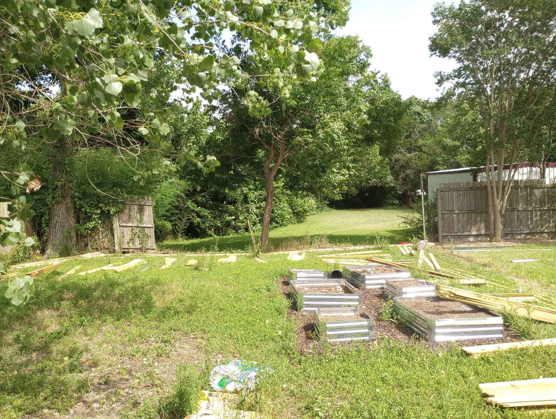 A wide-open backyard after a fence was removed